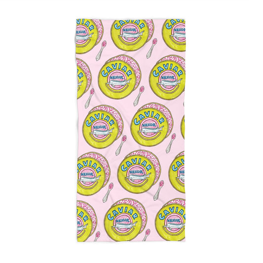 A rectangular beach towel featuring a repeating retro caviar tins n a pattern on a light pink background, shown flat against a white studio backdrop.