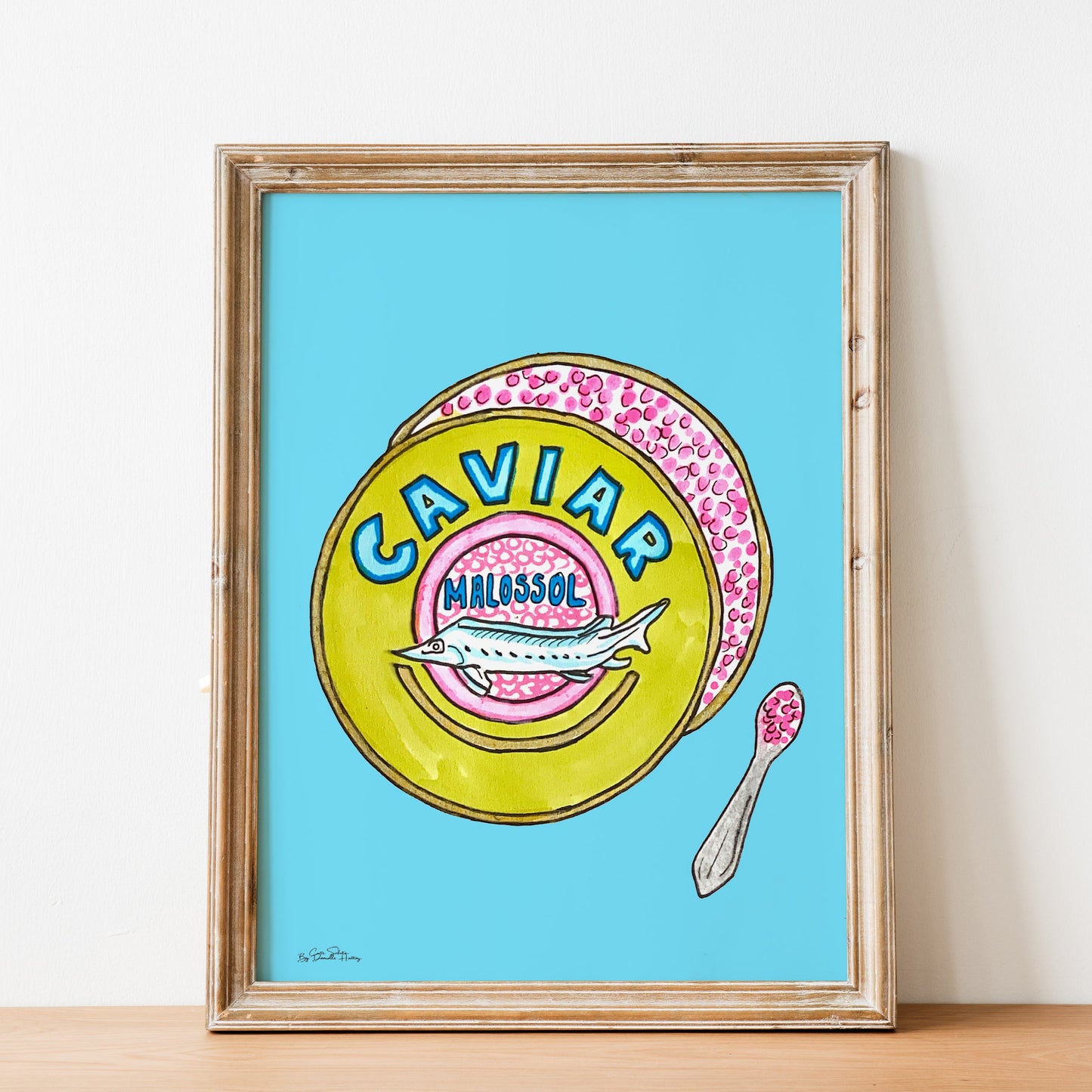 framed wall art of colorful caviar tin and spoon
