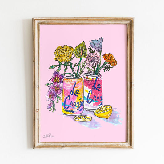 framed wall art of sparkling water can with flower