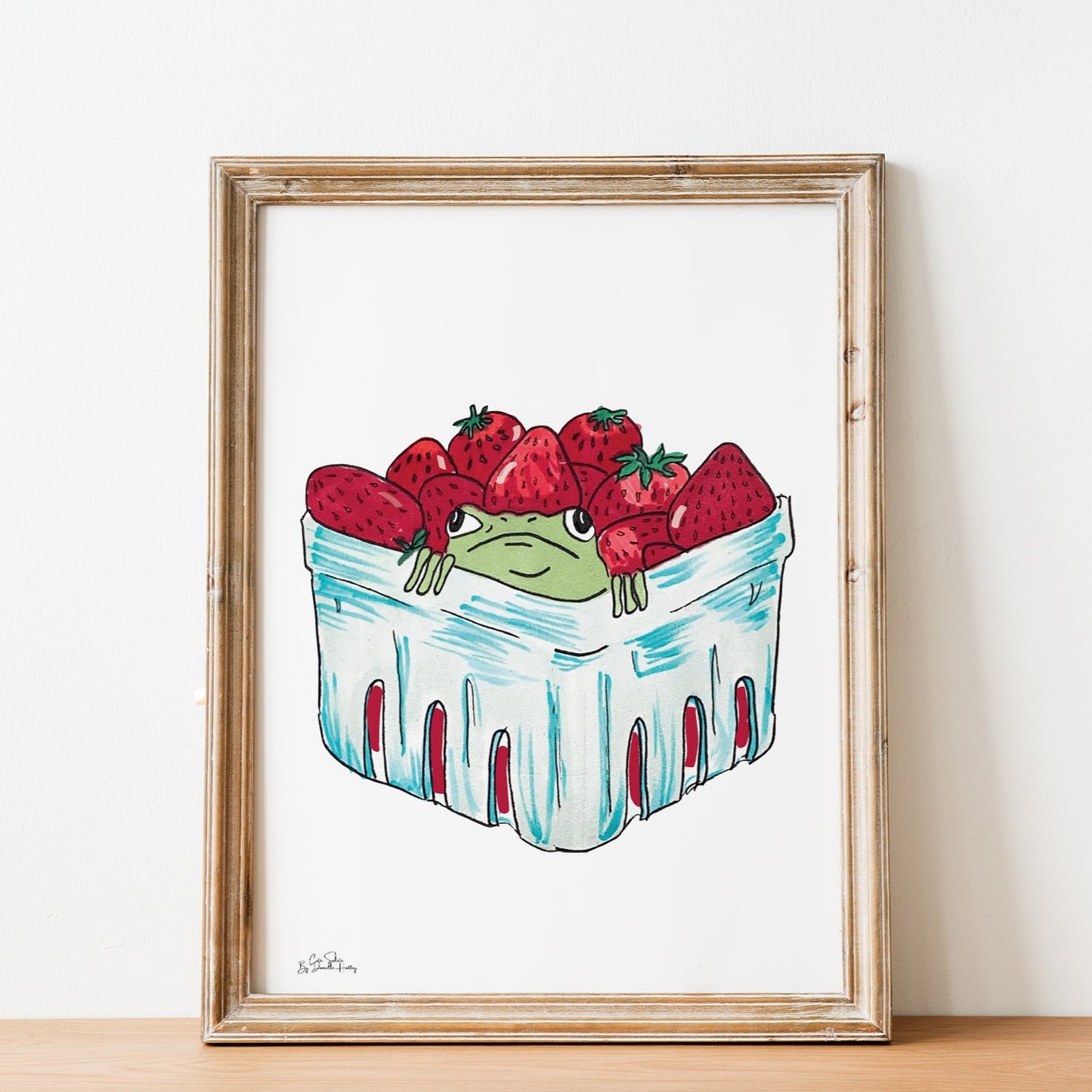 framed wall art of strawberry frog